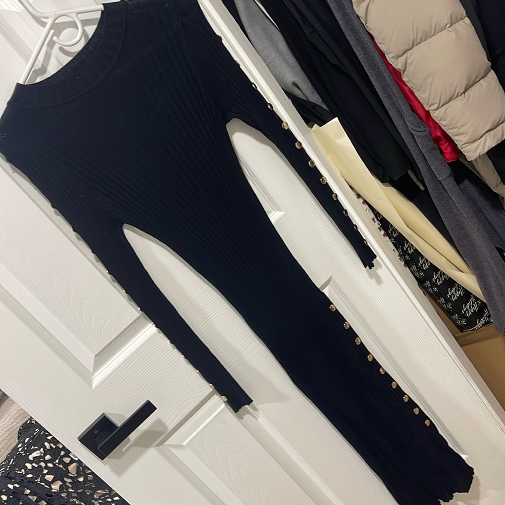 Knit black midi dress with gold accents